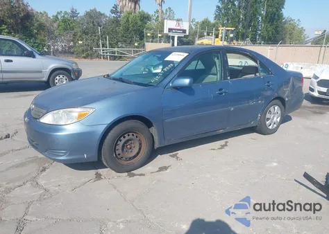 2002 Toyota Camry Le z USA, uszkodzony, nr VIN JTDBE32K520033900